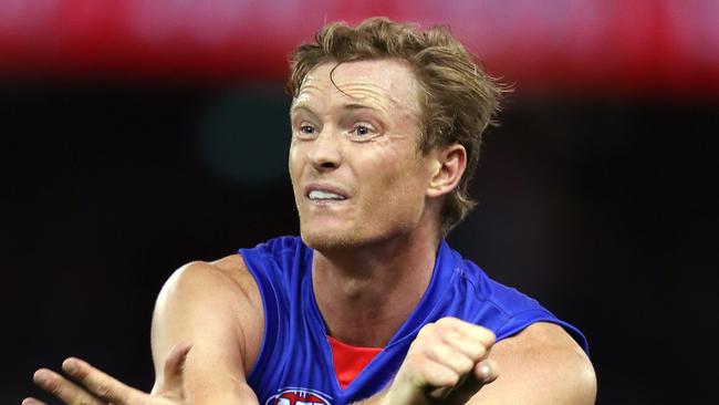 Alex Keath gets a handball away for Western Bulldogs during the Marsh Series.