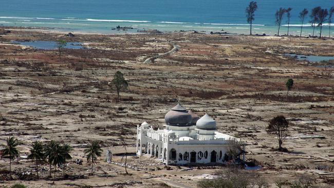 (FILES) This aerial file photo taken on January 16, 2005 shows a partly damaged mosque in the Lampuuk coastal district of Banda Aceh on Indonesia's Sumatra island, an area which was devastated in the earthquake and tsunami on December 26, 2004. Indonesia will mark on December 26, 2014 the 10th year anniversary of the deadly tsunami which killed more than 170,000 people in Aceh, and tens of thousands of others in other countries around the Indian Ocean. AFP PHOTO / FILES / JOEL SAGET