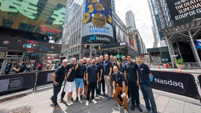 Titanium Ventures’ team celebrates its 100th investment in New York, a milestone featured on the Nasdaq billboard in Times Square.