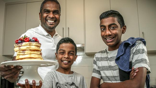 SA MasterChef contestant Sashi Cheliah in the kitchen at home with his children Ryan, 10, and Marcus, 12. Picture: Mike Burton/AAP