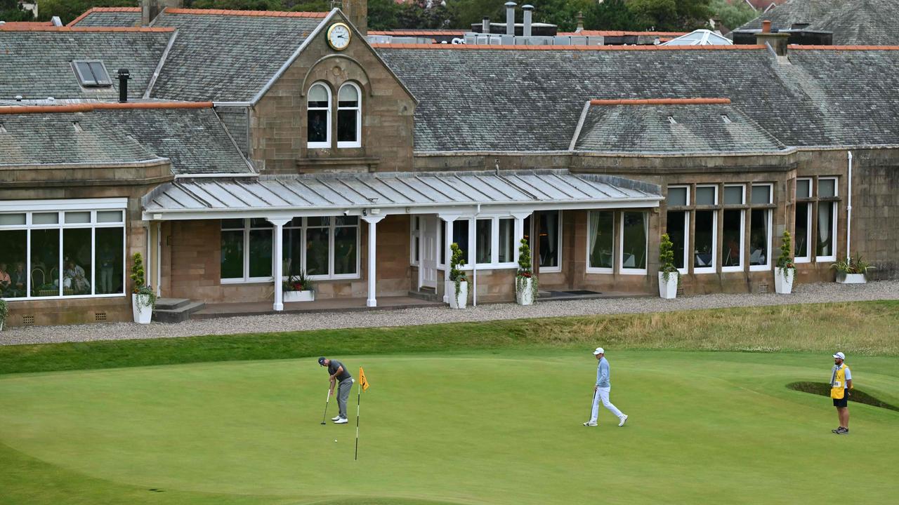 Australia's Adam Scott putts on the 18th green during his third round. Picture: Glyn Kirk/ AFP