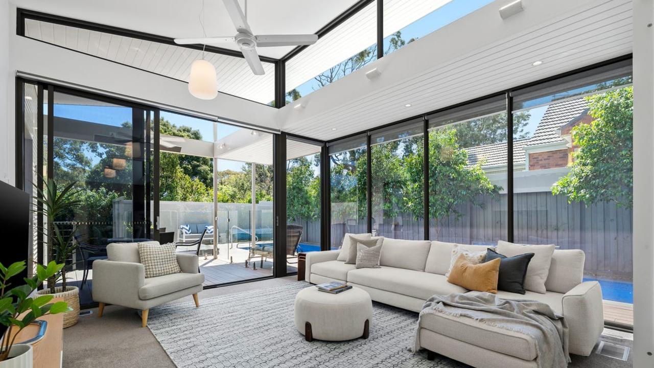 High ceilings, glazed walls and clerestory windows let in plenty of light and take in views of the pool.