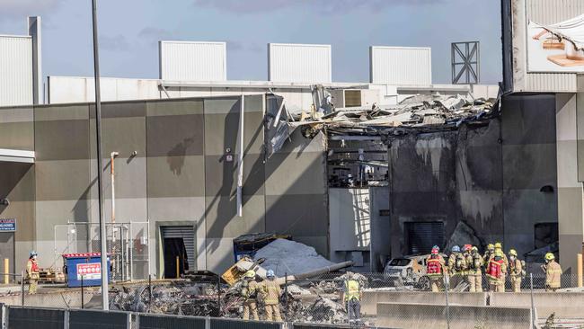 Fire Crews douse what looks like to be the fuselage. Picture: Jason Edwards