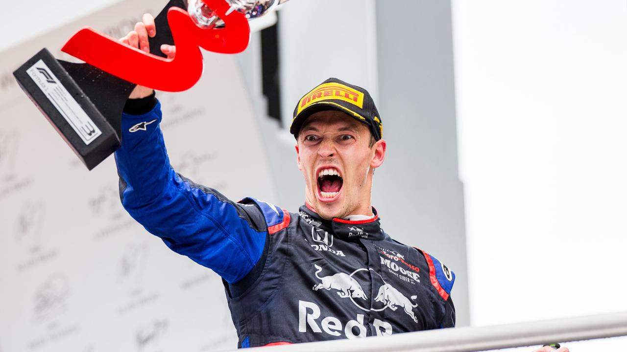 Daniil Kvyat celebrates third place for the German Grand Prix.