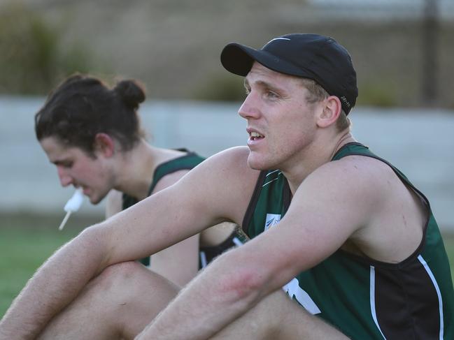 Tom Bell takes a break during a pre-season session at Greensborough. Picture: Nathan McNeill. 