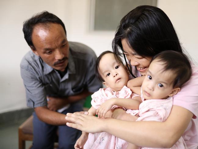 Mum Bhumchu Zangmo with Nima and Dawa and dad Sonam Tshering at the Jigme Dorji Wangchuck National Referral Hospital in Thimphu, Bhutan. Picture: Alex Coppel