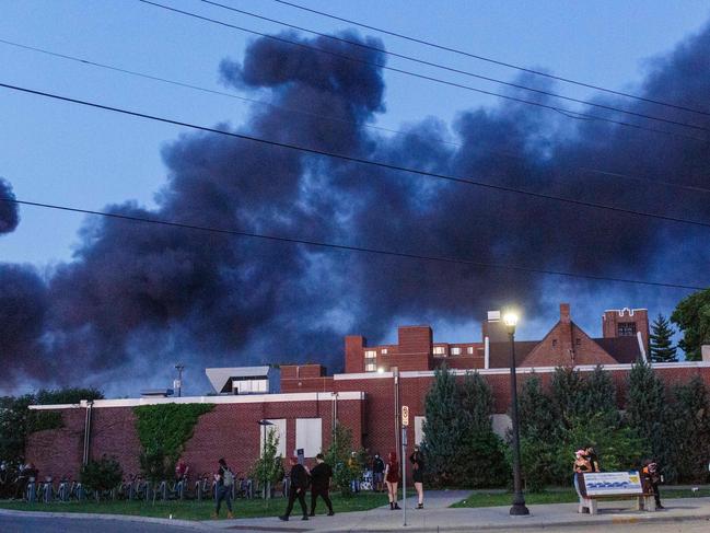 Flames rise from a post office in Minneapolis. Picture: AFP,