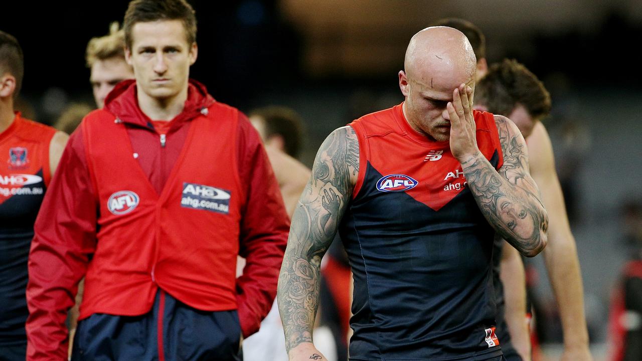 AFL- Melbourne v GWS at MCG, Melbourne. Nathan. Jones leads the team off after the loss. 17th August 2014. Picture: Colleen Petch.