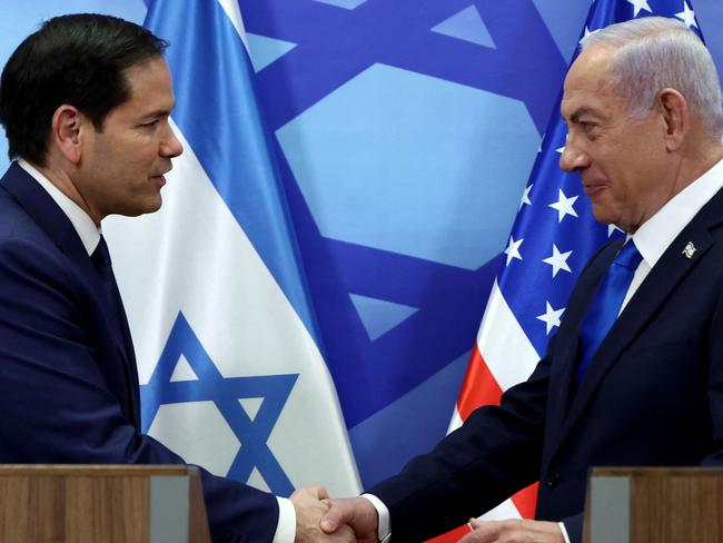 US Secretary of State Marco Rubio (L) and Israeli Prime Minister Benjamin Netanyahu shake hands during a joint press conference at the prime minister's office in Jerusalem on February 16, 2025. Rubio said on February 16 that the United States and Israel expect the Lebanese state to work towards disarming Lebanese armed group Hezbollah, which fought a deadly war with Israel last year. (Photo by Evelyn Hockstein / POOL / AFP)