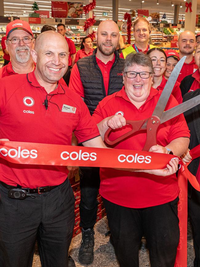 Store manager Michael Ferguson and long-serving member Noeleen Clark celebrate with staff. Pic: Supplied