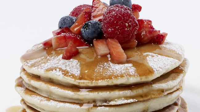 Classic French pancake stack with berries and syrup from Crepe Addict, Surfers Paradise.