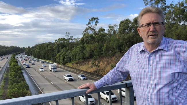 Coomera MP Michael Crandon overlooking the M1 traffic.