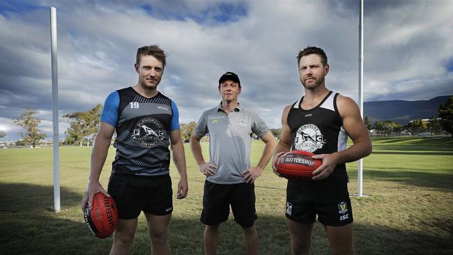 Glenorchy Magpies coach Paul Kennedy, flanked by his captain Brayden Webb, left, and Josh Arnold. Picture: MATHEW FARRELL