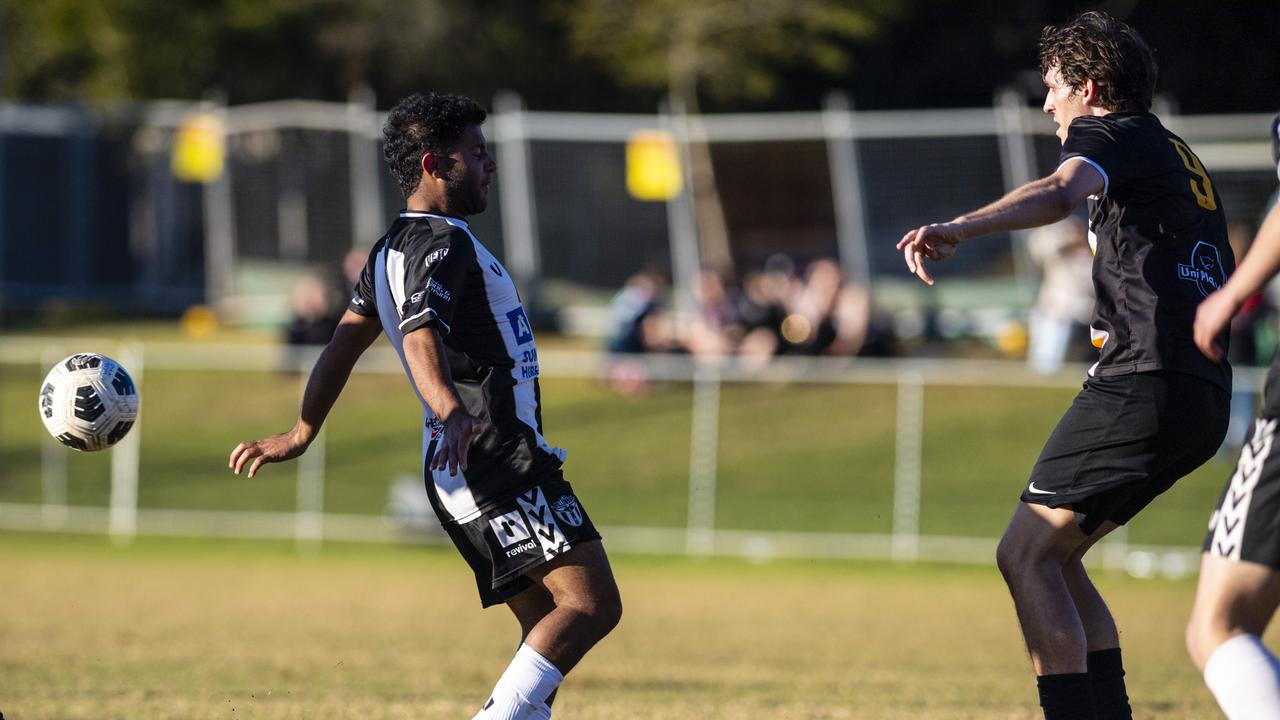 Callum Zadow (right) of West Wanderers defends an attack from Adnan Alharoni of Willowburn in FQPL Men Darling Downs Presidents Cup football at West Wanderers, Sunday, July 24, 2022. Picture: Kevin Farmer