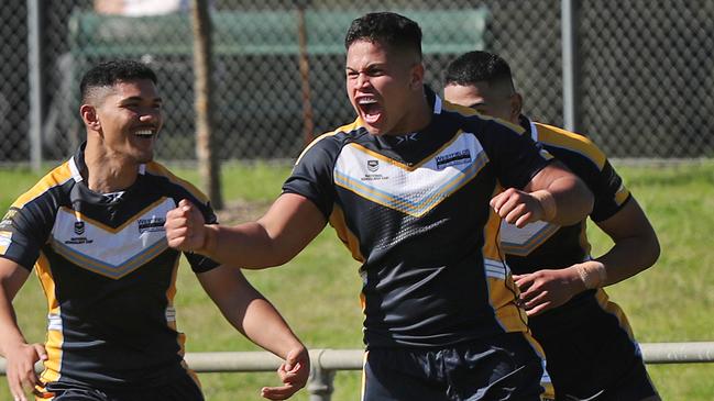 Pictured are players from Westfields Sports High School celebrating a try during NRL Schoolboy Cup at Moorebank Sports Hammondville Oval.Picture: Richard Dobson