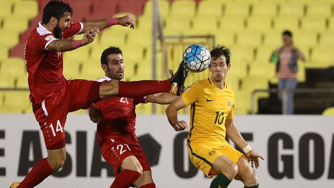 Tamer Hag Mohamad givs a studs up to Robbie Kruse.