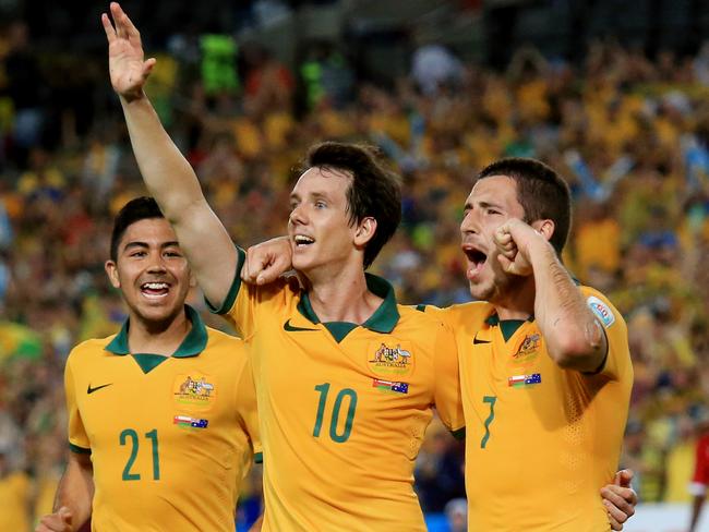 Australia's Robbie Kruse and Mathew Leckie salute the crowd.