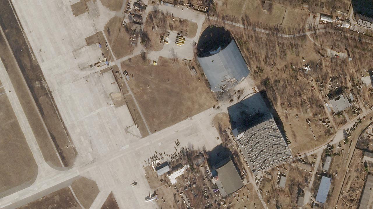 This Planet Labs PBC satellite image taken and released on February 28, 2022 shows damage to Antonov Airport in Hostomel, Ukraine. (Photo by Planet Labs PBC / AFP)