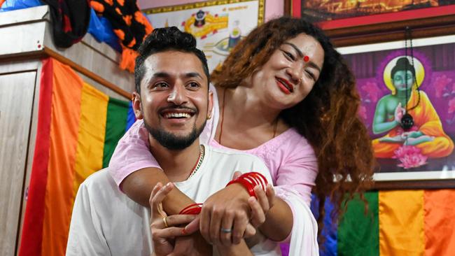 Surendra Pandey (L) and Maya Gurung, a transgender woman in Kathmandu. The LGBTQ couple has acquired a marriage certificate in Nepal, officials said on November 30, a first in South Asia. (Photo by Prakash MATHEMA / AFP)