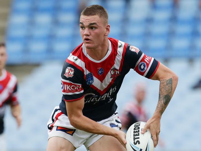 Roosters captain Thomas Deakin looks to offload. Picture: David Swift.