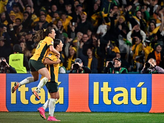 SYDNEY, AUSTRALIA - AUGUST 16: Sam Kerr #20 of Australia celebrates after scoring her team's first goal during the FIFA Women's World Cup Australia & New Zealand 2023 Semi Final match between Australia and England at Stadium Australia on August 16, 2023 in Sydney, Australia. (Photo by Gao Meng/VCG via Getty Images)