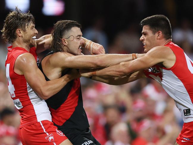 SYDNEY, AUSTRALIA - MARCH 23: Lewis Melican of the Swans and Sam Draper of the Bombers tussle during the round two AFL match between Sydney Swans and Essendon Bombers at SCG, on March 23, 2024, in Sydney, Australia. (Photo by Mark Metcalfe/AFL Photos/via Getty Images )