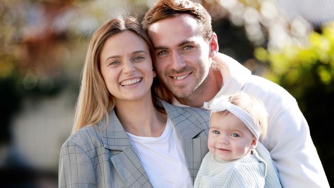 Port Adelaide’s Jeremy Finlayson and partner Kellie Gardner with daughter Sophia. Picture: Kelly Barnes