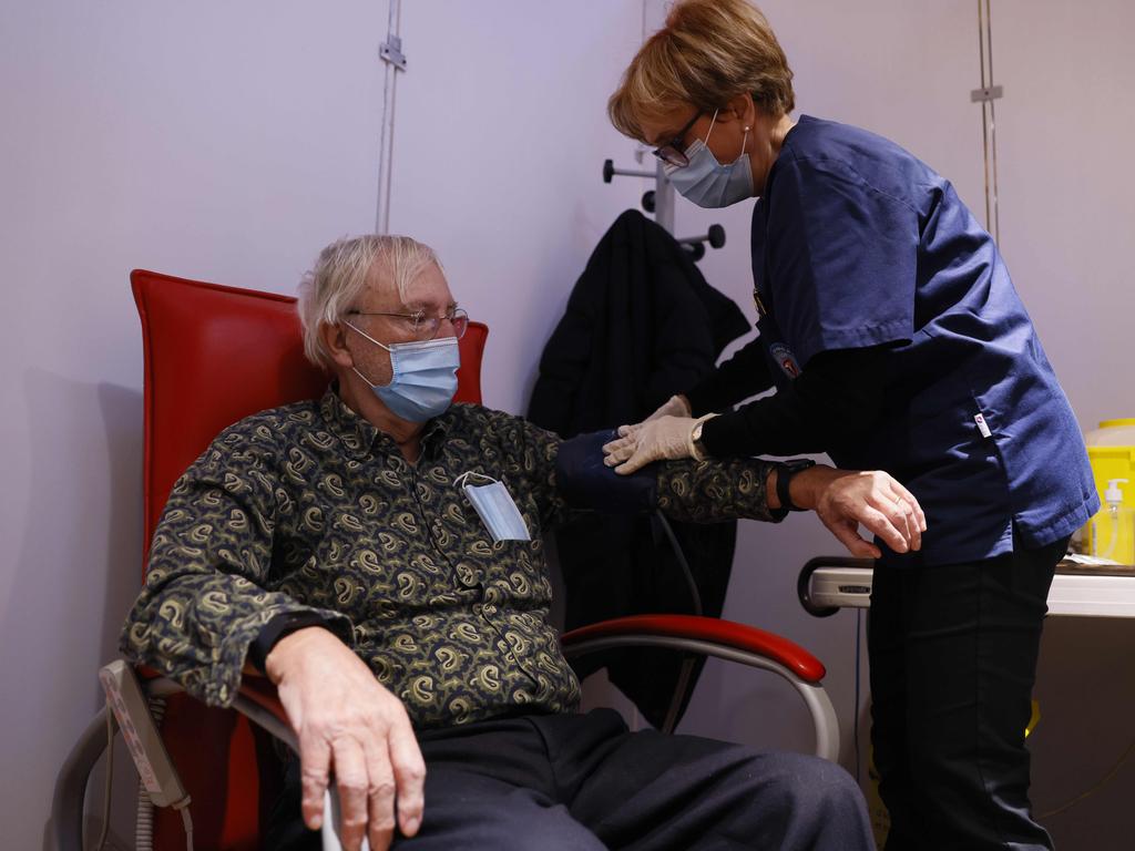 A health worker prepare to make an injection of the COVID-19 vaccine to an elderly man in Paris. Picture: AFP