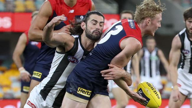 BRISBANE, AUSTRALIA - AUGUST 15: Brodie Grundy of the Magpies and Clayton Oliver of the Demons compete for the ball during the round 12 AFL match between the Melbourne Demons and the Collingwood Magpies at The Gabba on August 15, 2020 in Brisbane, Australia. (Photo by Glenn Hunt/Getty Images)