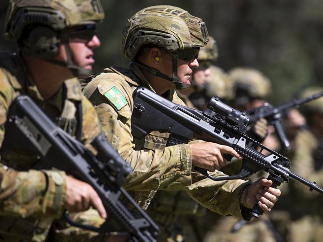 An Australian Army soldier stands at the low ready position during the champion shot stage of the Australian Army Skills at Arms Meet at the Greenbank Training Area, Queensland. *** Local Caption *** The Australian Army Skill at Arms (AASAM) competition is being held between 13 and 19 March 2020 at the Greenbank Training Area, Queensland. Around 160 shooters from the Royal Australian Navy, Australian Army and Royal Australian Air Force are competing to be named champion shot of their Service. The competition will also identify the Army’s top 20 shots who will be selected in the Australian Army Combat Shooting Team to represent the Australian Army in international marksmanship competitions. Since 1984, AASAM has been Australia's premier combat shooting tournament, with a growing reputation worldwide. It is now one of the world’s biggest military shooting competitions. AASAM is conducted by the Australian Army’s Combined Arms Training Centre (CATC) as a part of Army’s broader training and professional development programs to ensure Australian Army soldiers remain ready for warfighting as experts in the profession of arms.