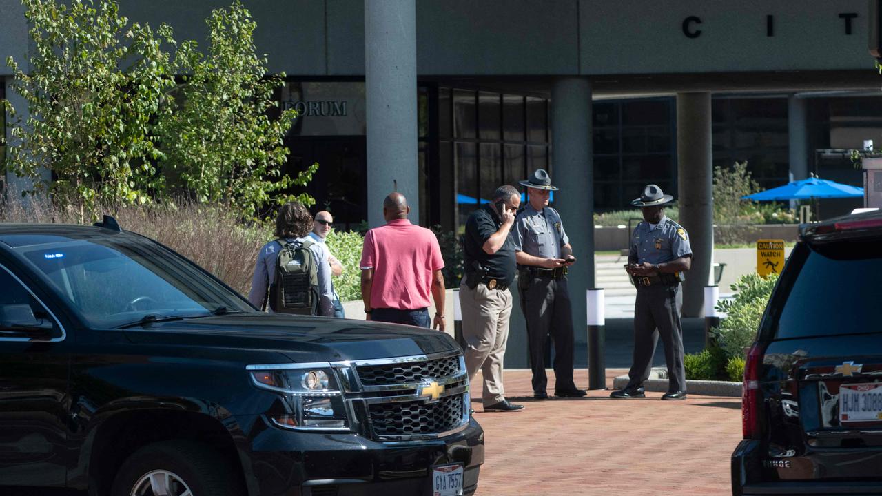 Police officers stand outside the Springfield City Hall after bomb threats were made. Picture: Roberto Schmidt/AFP