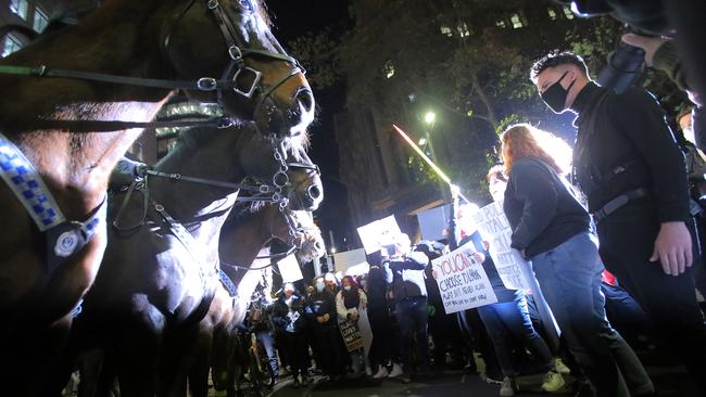 Protesters face off with police on horseback during a Black Lives Matter rally in Sydney. Picture: Steven Saphore