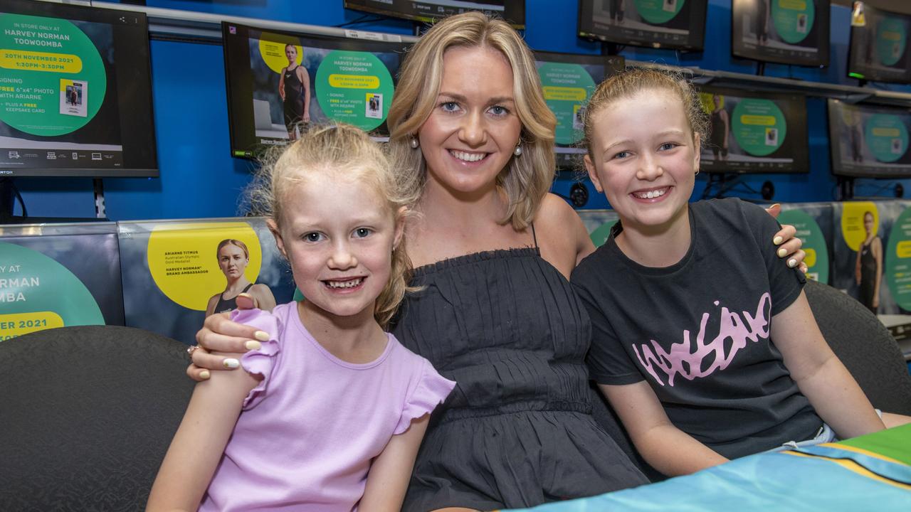 (from left) Maggie Stevens, Ariarne Titmus and Charlotte Stevens. The Stevens sisters are from the Allora swim club. Fans meet Harvey Norman Brand Ambassador and Olympic Gold Medalist Ariarne Titmus. Saturday, November 20, 2021. Picture: Nev Madsen.