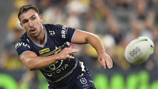 TOWNSVILLE, AUSTRALIA - JUNE 18:  Reece Robson of the Cowboys passes the ball during the round 15 NRL match between the North Queensland Cowboys and the Cronulla Sharks at QCB Stadium, on June 18, 2021, in Townsville, Australia. (Photo by Ian Hitchcock/Getty Images)