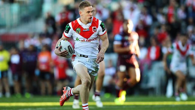 Matthew Dufty sprints away to score a try on debut for the Dragons. Picture: Brett Costello