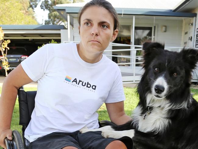 ****EXCLUSIVE NEWS360 PREMIUM LOCKED CONTENT - AUS OUT, NEWS.COM.AU OUT, SKY NEWS OUT****  Rebecca Meyers at home in Culcairn, NSW with her dog Maze. Rebecca is suing Tiger Airways after a suitcase fell from an overhead locker onto her shoulder. Picture: Brad Newman