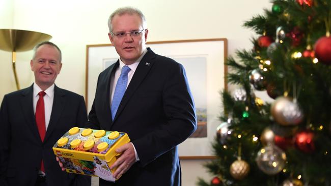 Bill Shorten and Scott Morrison at a charity Christmas present collection at Parliament House yesterday. Picture: Getty Images