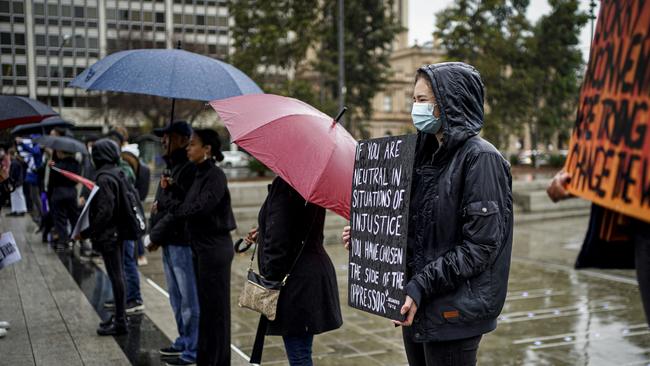 The Black Lives Matter protest in Adelaide in the rain on Saturday. Picture: Mike Burton