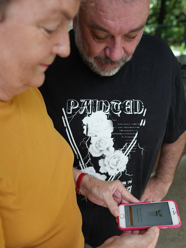 Jan McLucas and Bradley Smith use the Sharewaste app to connect to people who wish to recycle their food scraps and other organics with their neighbours who are already composting. Picture: Nuno Avendano