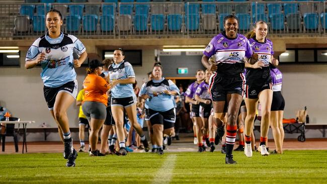 The Litchfield Bears run on in their purple women in league jerseys against the Northern Sharks. Picture: Karen Fowler