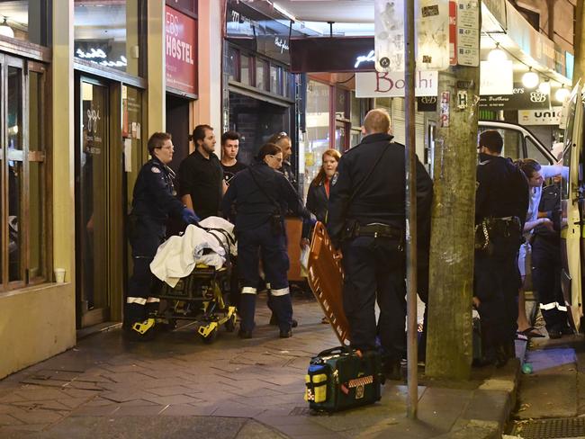 An assault outside the EBS Hostel located on King St Newtown. Picture: Gordon McComiskie