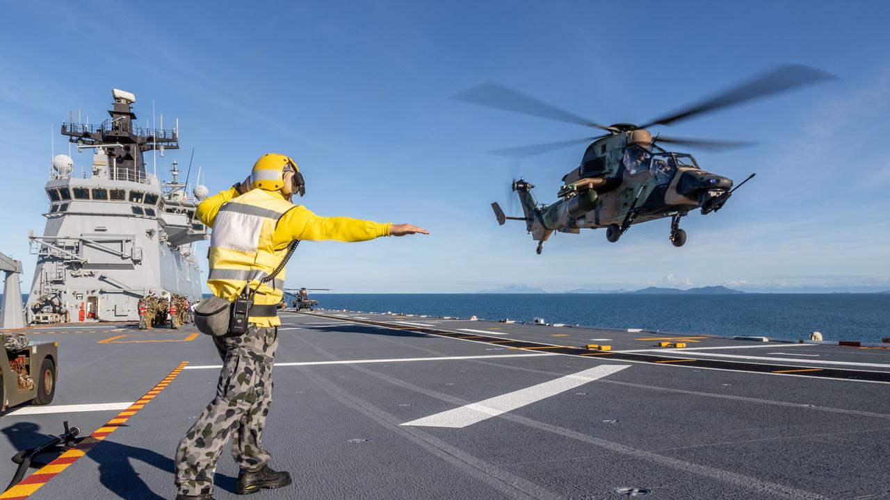 An Australian Army Tiger Armed Reconnaissance Helicopter conducting deck landings on HMAS Canberra, during Exercise Sea Explorer.