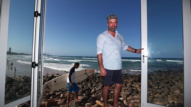 Burleigh Pavilion general manager John Forest posing with the removable bi-fold doors Photograph: Jason O'Brien