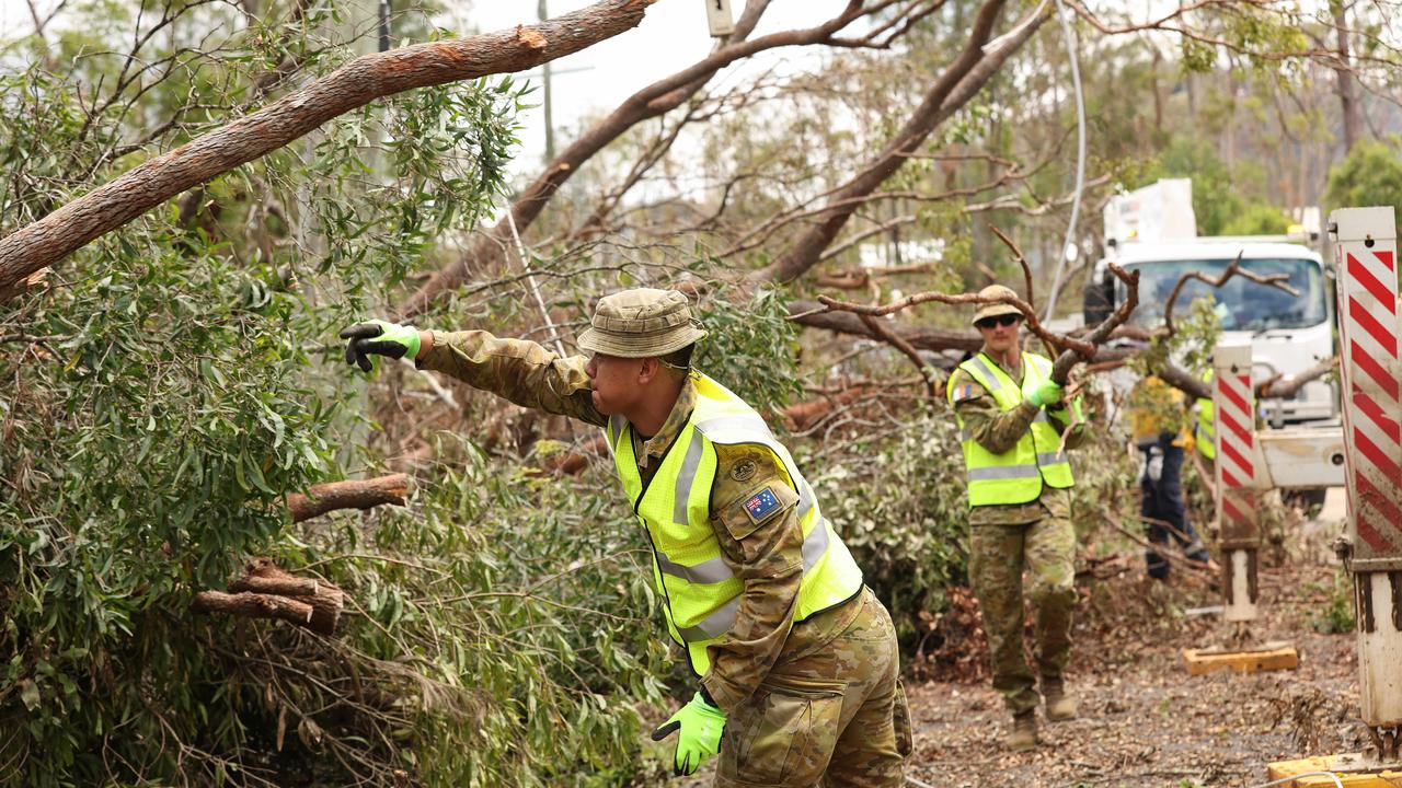 ADF help in the clean up at Kriedman Road in Wangawallan after ferocious storms dame the Gold Coast area. Pics Adam Head