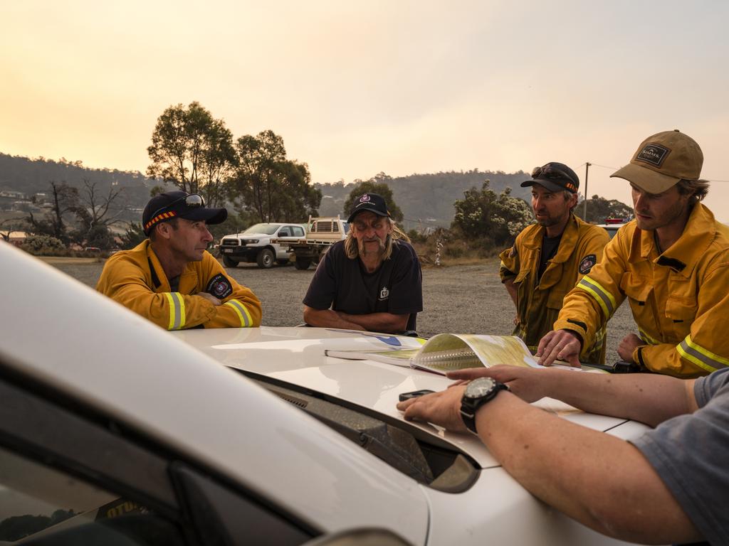 Firefighters plan their attack at Miena. Picture: Heath Holden/Getty