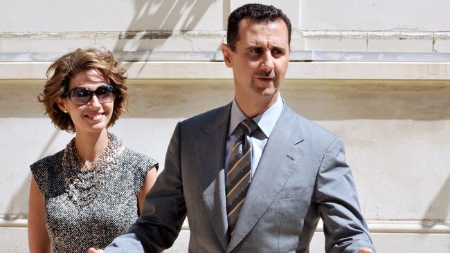 Syrian President Bashar al-Assad and his wife Asma arrive at the Elysee palace in Paris on July 14, 2008. Picture: Dominique Faget/AFP