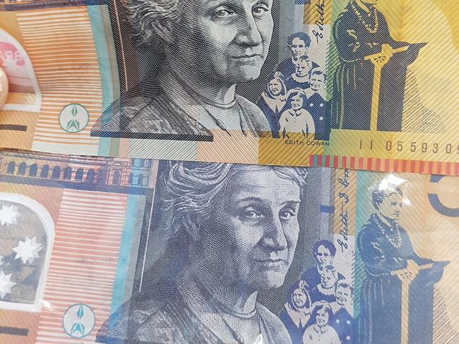 One of the fake notes (below) compared with the real thing (above).