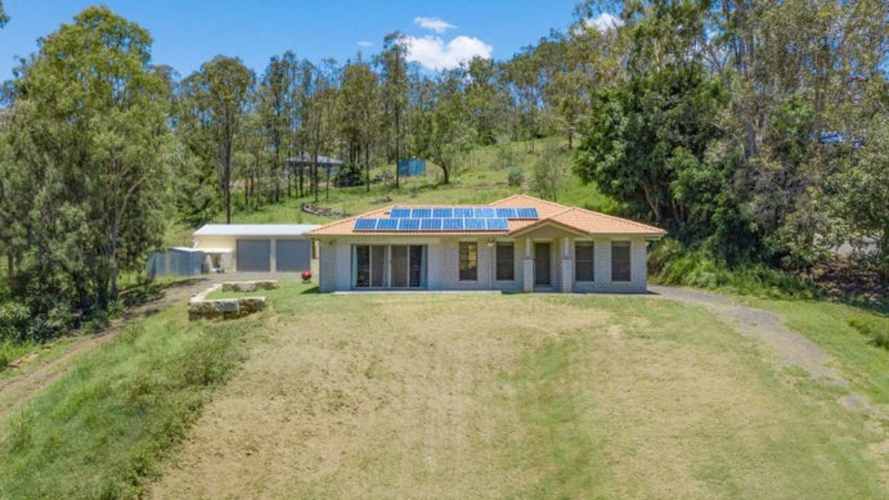 Listed for offers over $515,000, this modern four bedroom house at Kooralbyn sits on a 0.43ha block