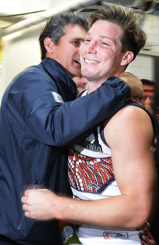 Greene celebrates a win with Giants coach Leon Cameron. Picture: AFL Media/Getty Images