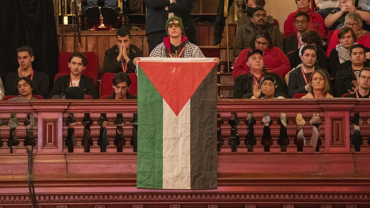 A single delegate unfurled a Palestine flag from the upstairs gallery atthe NSW Labor conference held at Sydney Town Hall. Picture: NewsWire / Simon Bullard.